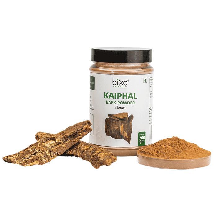 Bixa Botanical Kaiphal Powder, Ayurvedic herbal powder in a clear glass jar with a wooden scoop, showcasing the natural spice.