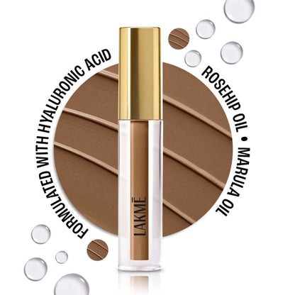 Lakme 9 To 5 Hya Matte Liquid Concealer in Cocoa, close-up shot showing the applicator and sleek packaging.