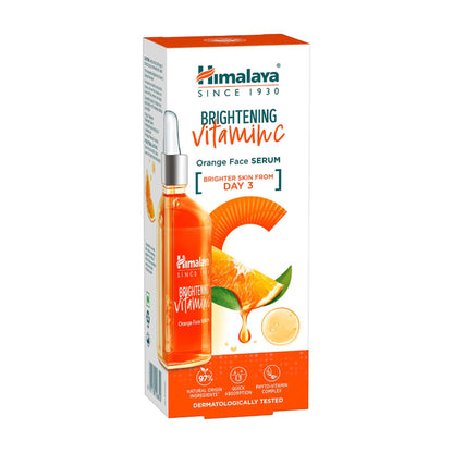 Himalaya Brightening Vitamin C Orange Face Serum with 5x Vitamin C and Hyaluronic Acid, showing the serum bottle and fresh oranges.