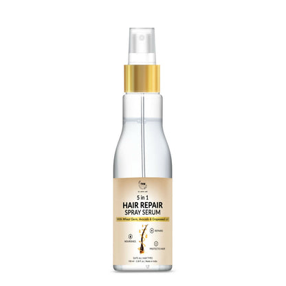 The Natural Wash 5-in-1 Hair Spray Serum with wheat germ oil, showing a sleek bottle with a pump dispenser for hair care.