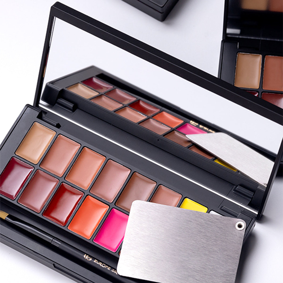 Europe Girl Kiss Me Lip Palette featuring assorted lip shades in a compact palette, perfect for vibrant, kissable lips.