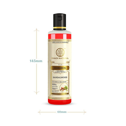 Khadi Natural Sandalwood Massage Oil in a clear glass bottle, showcasing the product with a natural wooden cap and sandalwood label.