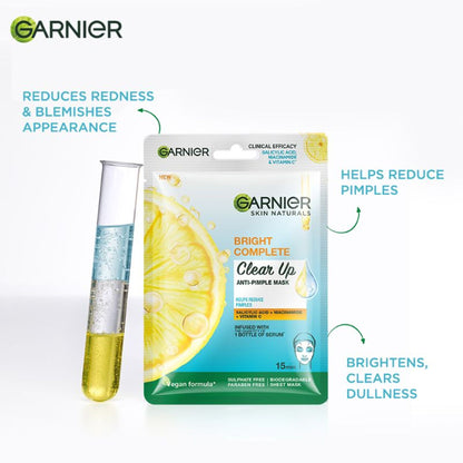 Garnier Bright Complete anti-pimple sheet mask with salicylic acid, niacinamide, and vitamin C serum on a clear skin background