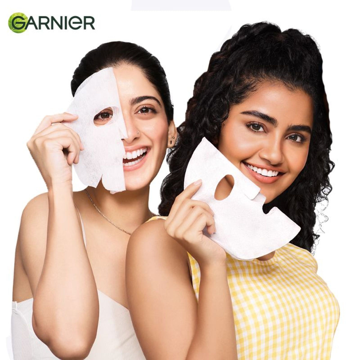Garnier Bright Complete anti-pimple sheet mask with salicylic acid, niacinamide, and vitamin C serum on a skincare display