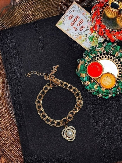 Indyancart Women Gold Plated Ad Bracelet Rakhi With Roli Chawal Chandan Mishri