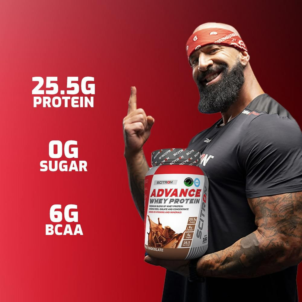 Scitron Advance Whey Protein Health Drink with Milk Chocolate flavor, showing a glass filled with creamy chocolate protein shake.