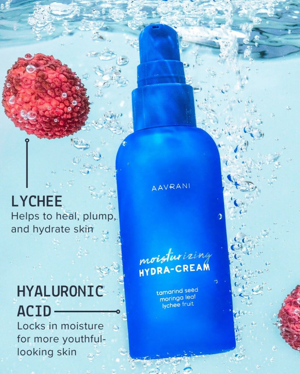 Aavrani Hydra-Moisturizer face cream in a white jar with a gold lid, showcasing its smooth, creamy texture.