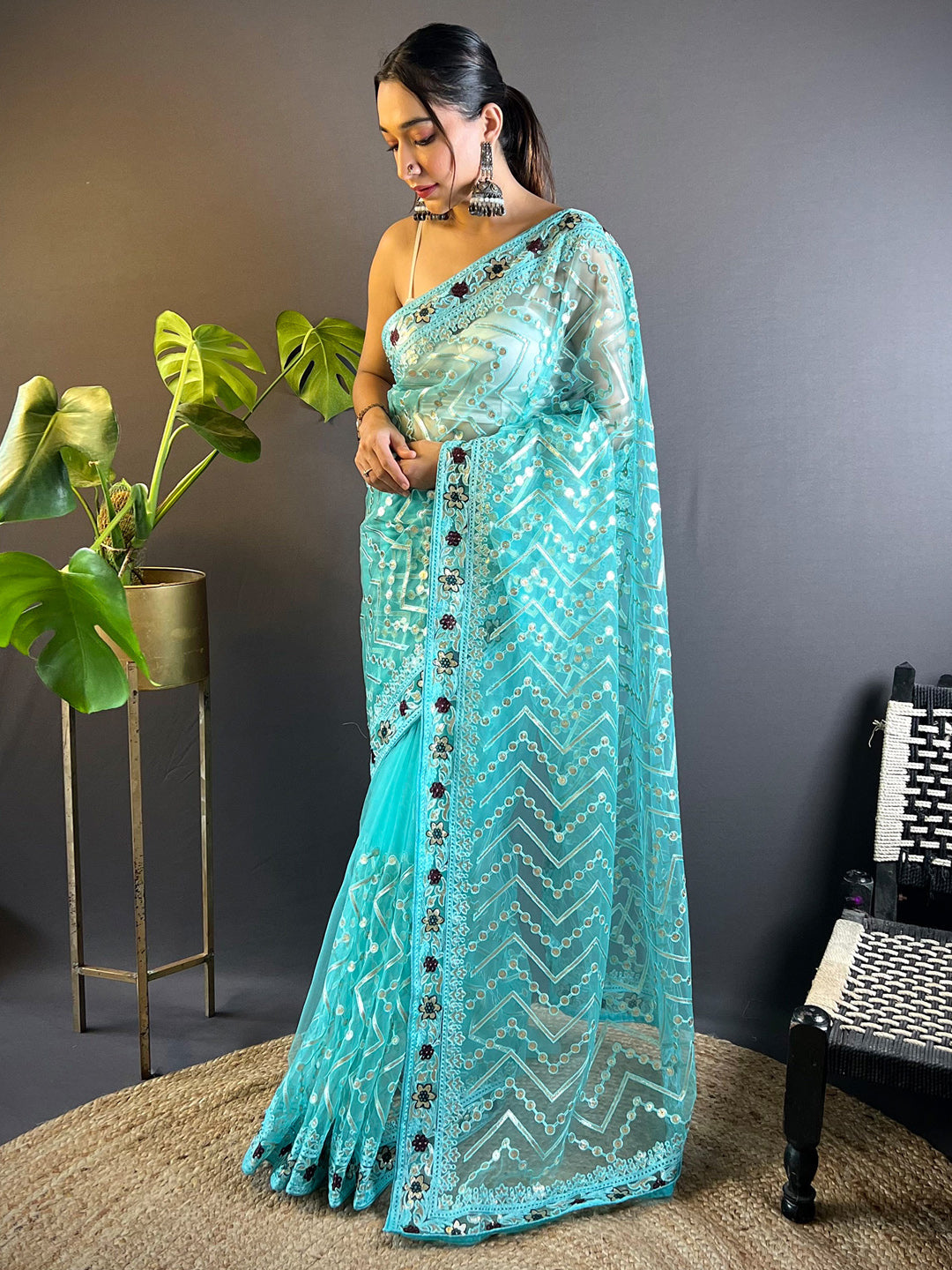 Women's Net Light Blue Embellished Designer Saree With Blouse Piece