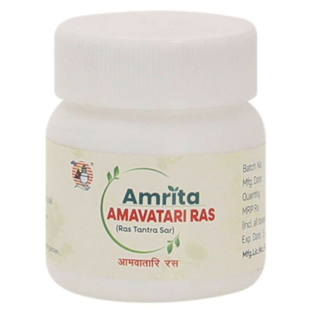 Amrita Amavatari Ras Ayurvedic tablets in a glass container, showcasing traditional herbal medicinal tablets.