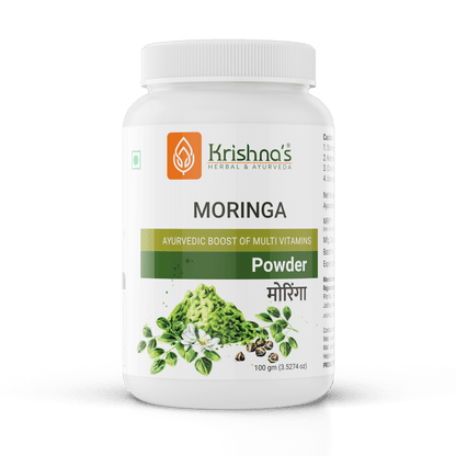Krishna's Herbal & Ayurveda Moringa Powder in a clear glass jar with a scoop, showing vibrant green powder and fresh Moringa leaves.