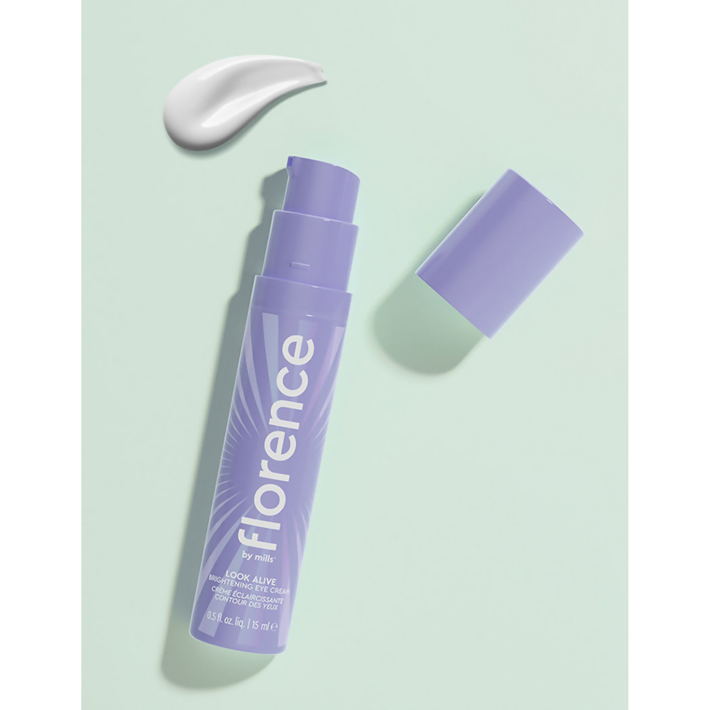 Florence by Mills Look Alive Brightening Eye Cream in a small jar, showing the creamy texture and brightening formula for under-eye care.
