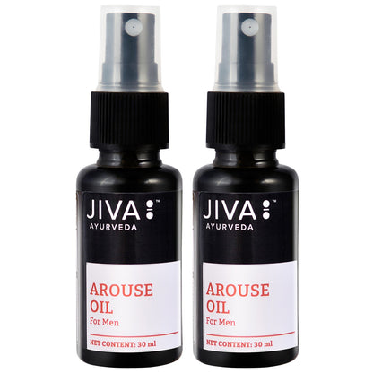 Jiva Ayurveda Arouse Oil bottle with herbal ingredients in a natural setting, showcasing Ayurvedic oils for wellness.