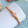 Dhiyona Red Stone Studded & Beaded Tortoise Charm Thread Rakhi With Roli Chawal