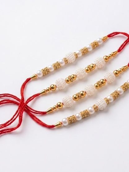 Anouk Set Of 4 White Pearls & Red Thread Rakhi With Roli Chawal Chandan Mishri