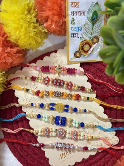 Anouk Set Of 7 Multicolor Designer Thread Rakhi With Roli Chawal Chandan Mishri
