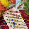 Dhiyona Set Of 7 Multicolor Designer Thread Rakhi With Roli Chawal Chandan Mishri