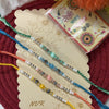 Dhiyona Set Of 4 Multicolor Artificial Beads Thread Rakhi With Roli Chawal Chandan Mishri