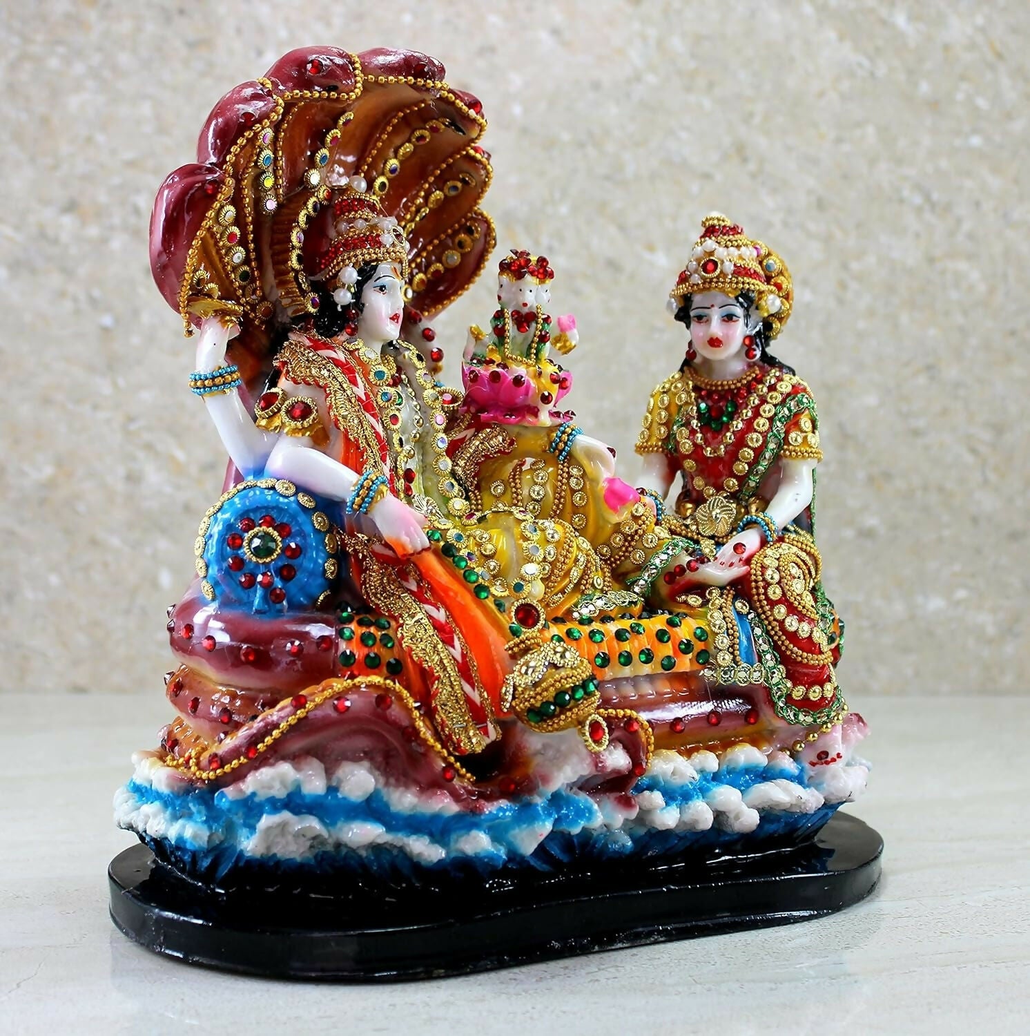 Hindu God idol of Vishnu with Laxmi in Ksheer Sagar, detailed sculpture representing divine figures in traditional style