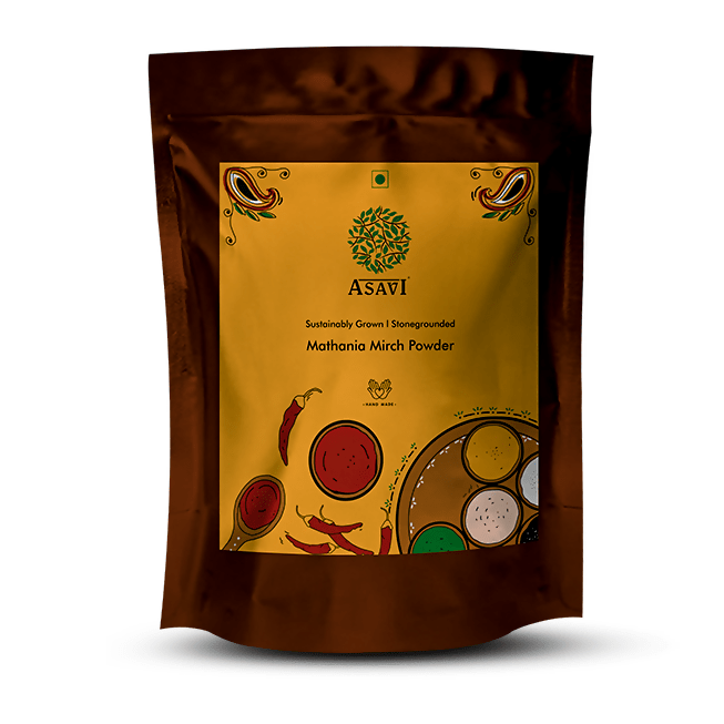 Asavi Stone Grounded Mathania Chilli Powder in a glass jar, vibrant red chili powder for cooking and seasoning.