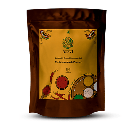 Asavi Stone Grounded Mathania Chilli Powder in a glass jar, vibrant red chili powder for cooking and seasoning.
