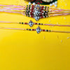Dhiyona Set Of 12 Beaded Cotton Thread with AD Stones & Meenakari Designer Rakhi for Brother