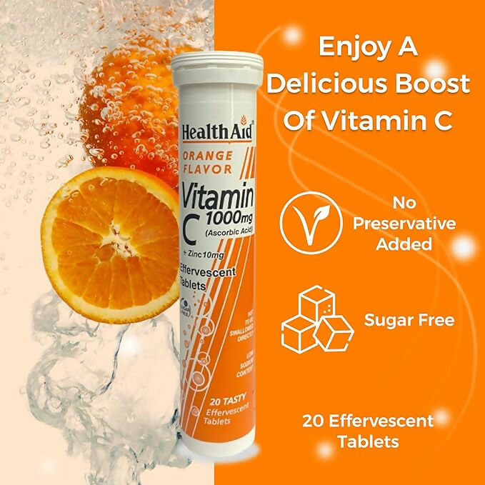 HealthAid Vitamin C 1000mg orange-flavored effervescent tablets with zinc, Ayurvedic health supplement in a glass of dissolved tablet.