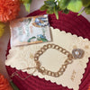 Dhiyona Women Gold Plated Ad Bracelet Rakhi With Roli Chawal Chandan Mishri