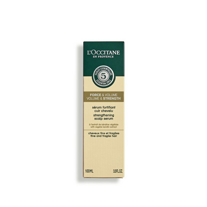 L'Occitane Strength & Volume Scalp Serum bottle with dropper for nourishing hair treatment and scalp care.