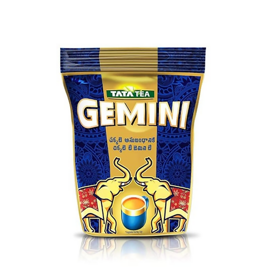 Tata Tea Gemini Strong Assam Black Tea powder in a clear container, highlighting the tea's rich, dark color and packaging.