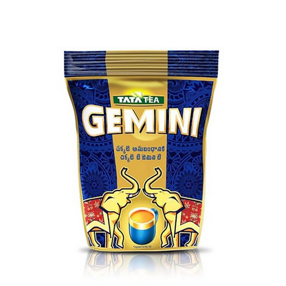 Tata Tea Gemini Strong Assam Black Tea powder in a clear container, highlighting the tea's rich, dark color and packaging.