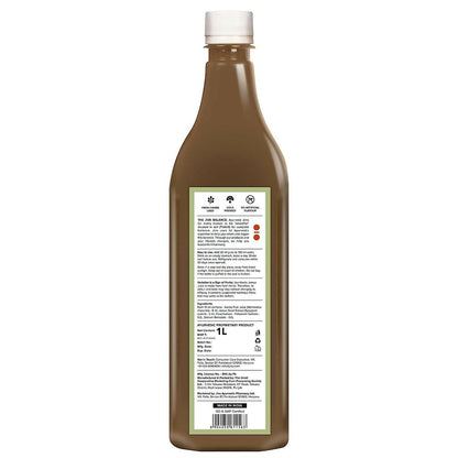 Jiva Ayurveda Karela Jamun Juice in a glass bottle, showcasing the herbal Ayurvedic drink with fresh ingredients and vibrant label.