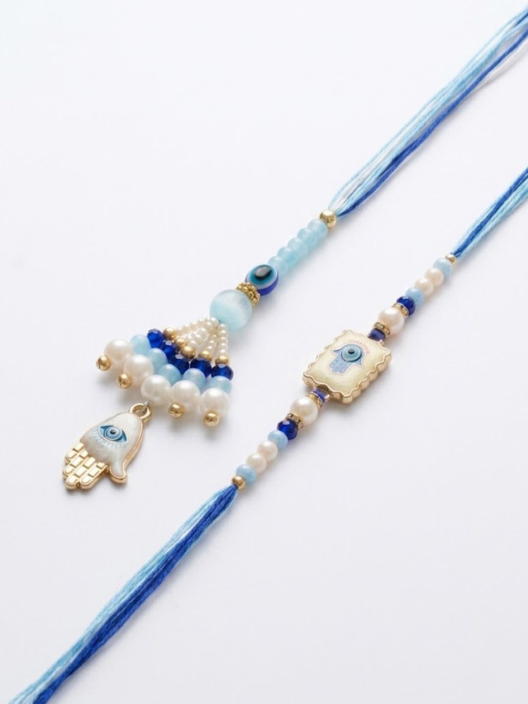 Anouk Set Of 2 Evil Eye Hand Design Bhaiya Bhabhi Rakhi With Roli Chawal Chandan Mishri