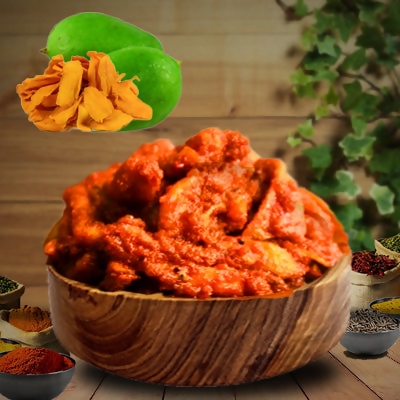 Gummadi Foods Maagaya Pickle in a glass jar, showing the vibrant, spicy North Indian pickle with visible mango pieces and spices.