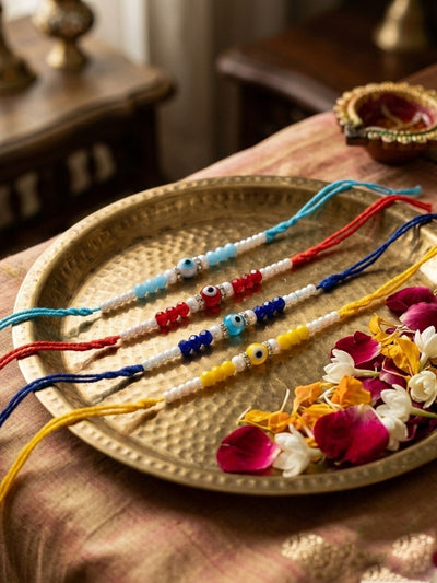 Dhiyona Set Of 4 Multicolor Evil Eye Thread Rakhi With Roli Chawal Chandan Mishri