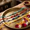 Dhiyona Set Of 4 Multicolor Evil Eye Thread Rakhi With Roli Chawal Chandan Mishri