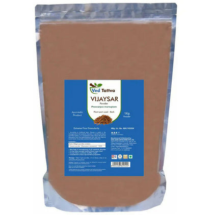 Ved Tattva Vijaysar powder in a clear container, showing fine brownish herbal powder for traditional Ayurvedic use.