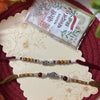 Dhiyona Set Of 2 Silver Toned Religious Rakhi Thread Rakhi Roli Chawal Chandan Mishri