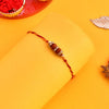 Dhiyona Gold-Toned Beaded Rakhi With Roli Chawal & Greeting Card