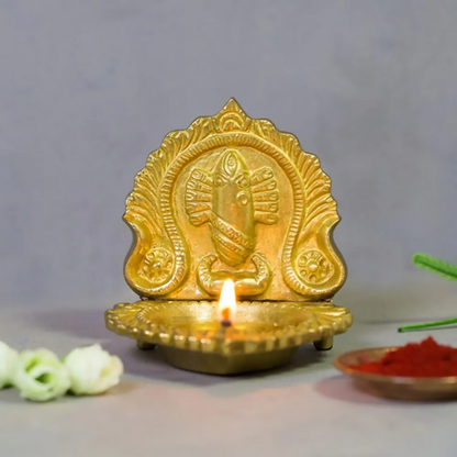Brass Linga Bhairavi idol lamp by Isha Life, featuring intricate design and traditional craftsmanship, used for spiritual rituals.