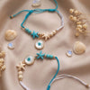 Dhiyona Set Of 2 Blue Evil Eye & White Pearl Bhaiya Bhabhi Rakhi With Roli Chawal Chandan