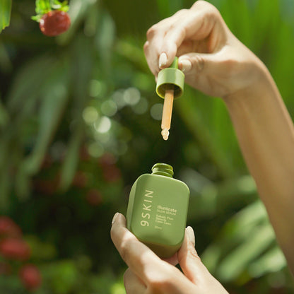 9skin Illuminate Glow Serum bottle with dropper, showcasing sleek packaging and transparent liquid for radiant skin.