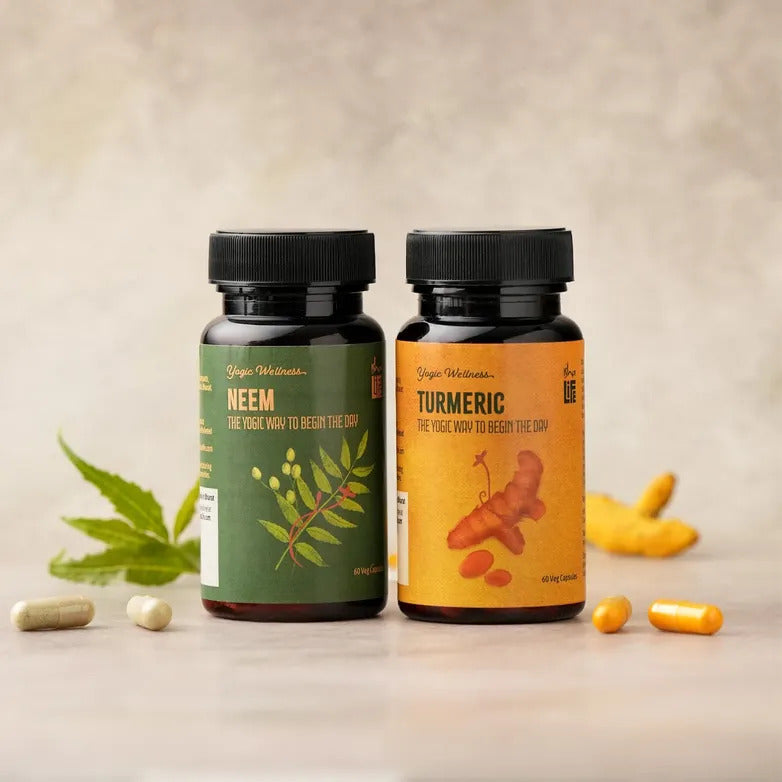 Isha Life Neem and Turmeric Ayurvedic capsules in clear bottles, showcasing natural herbal supplement for health.