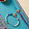Dhiyona Set Of 2 Artificial Beads Radha Krishna Bhaiya Bhabhi Rakhi With Roli Chawal Chandan