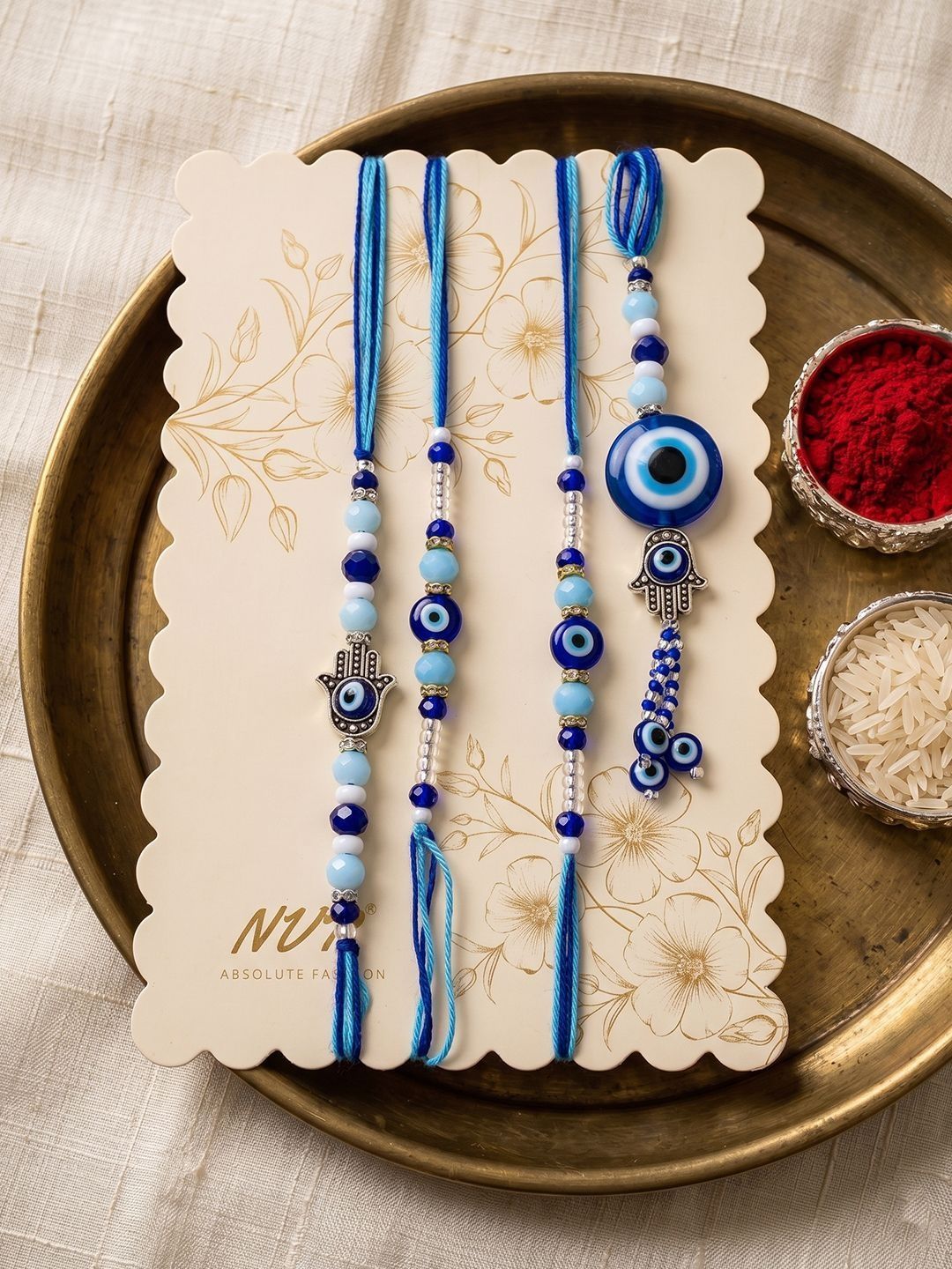 Anouk Set Of 4 Designer Blue Evil Eye Thread Rakhi With Roli Chawal Chandan Mishri