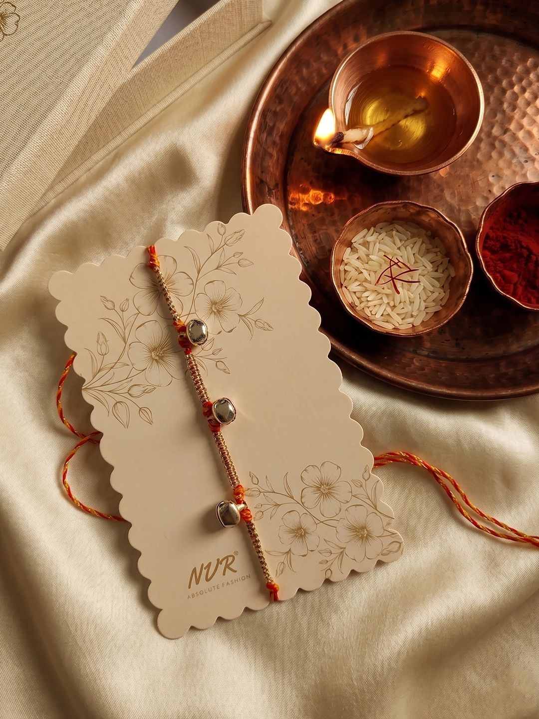 Anouk Golden Ghungroo Thread Rakhi With Roli Chawal Chandan Mishri