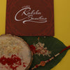 Dhiyona Unisex Set Of 2 Beaded Thread Rakhi With Greeting Card