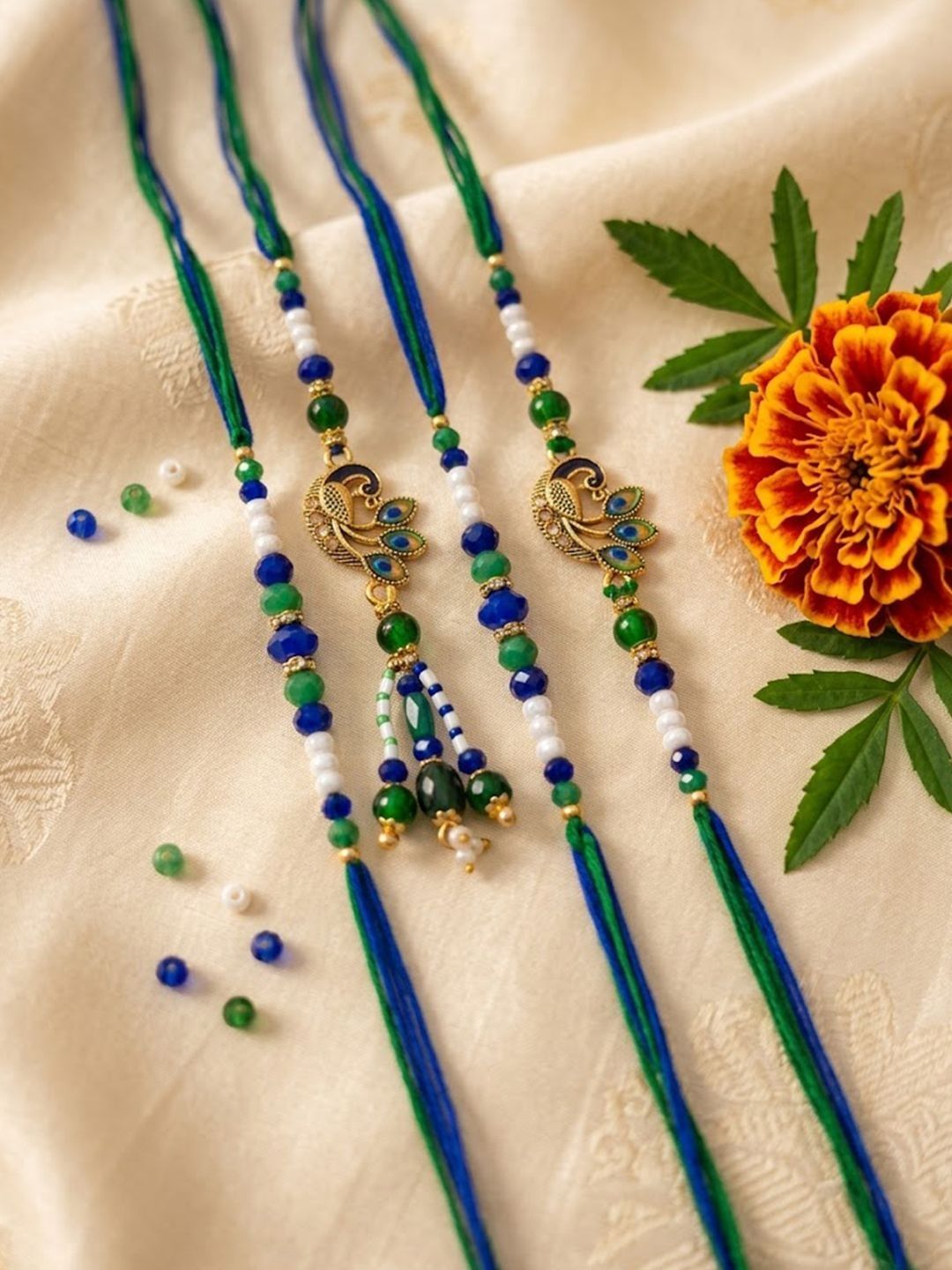 Anouk Set Of 4 Green Peacock Design Artificial Beads Thread Rakhi With Roli Chawal
