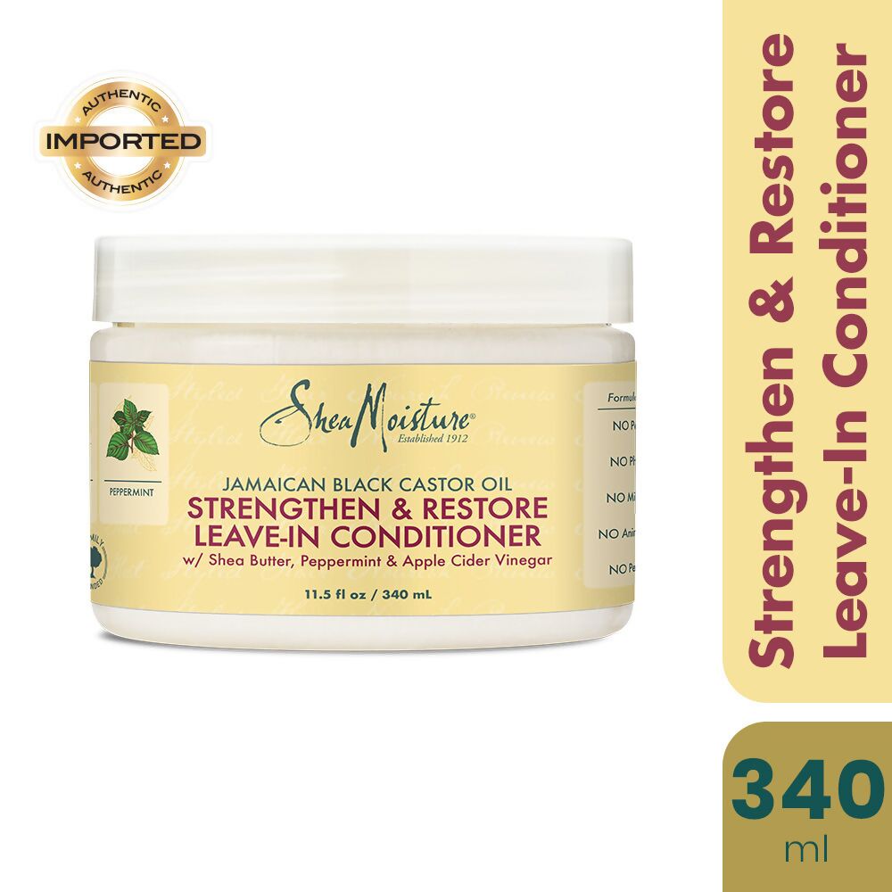 Shea Moisture Strengthen & Restore Leave-In Conditioner for damaged hair, creamy formula in a pump bottle, natural ingredients.