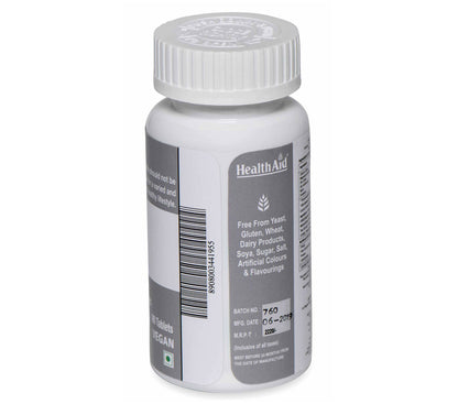 HealthAid Calmagzinc Ayurvedic tablets in a blister pack, showing white tablets for bone and immune health support.