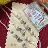 Dhiyona Set Of 3 White Pearls Thread Rakhi With Roli Chawal Chandan Mishri